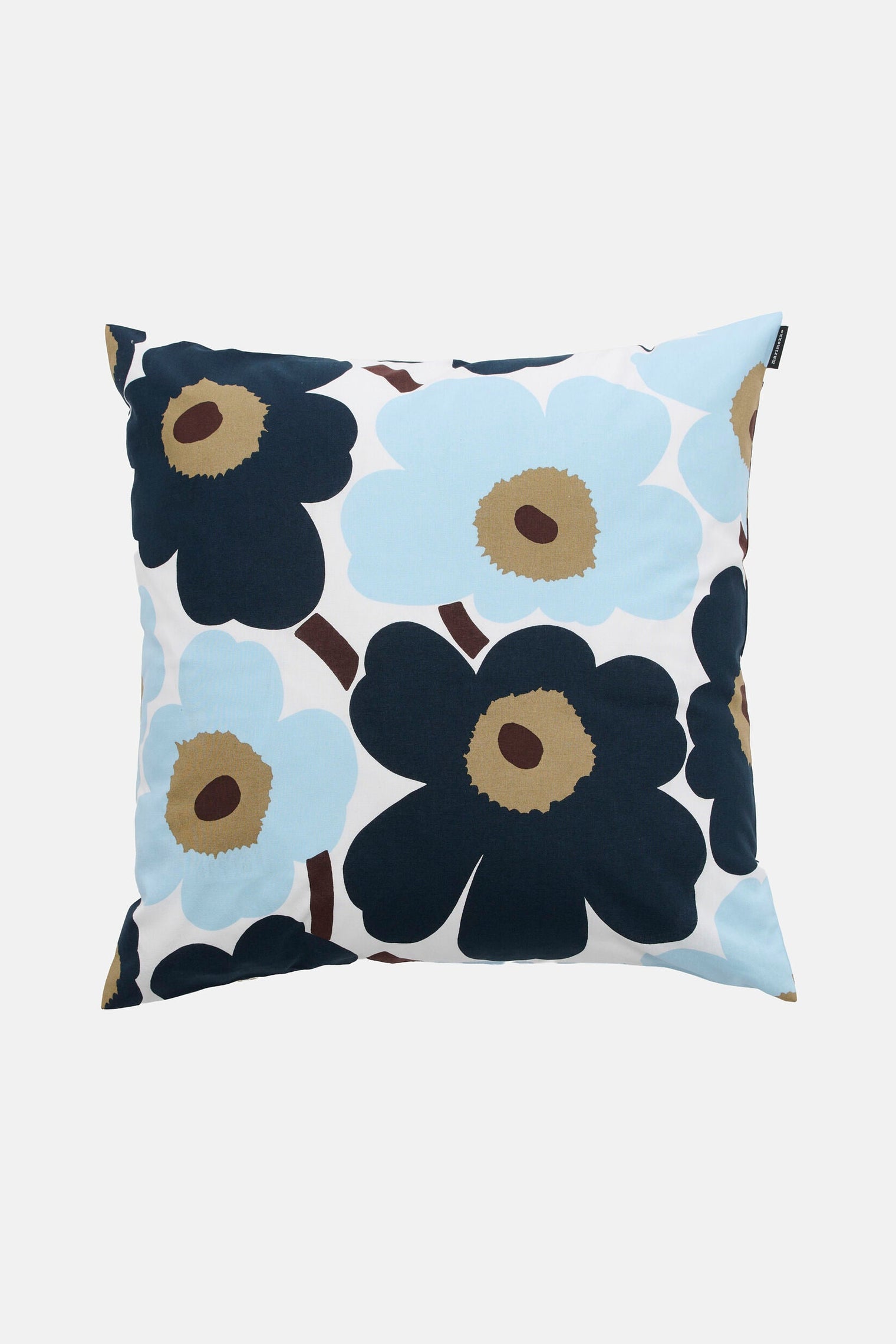 Floral patterned pillow with blue and navy flowers on a white background