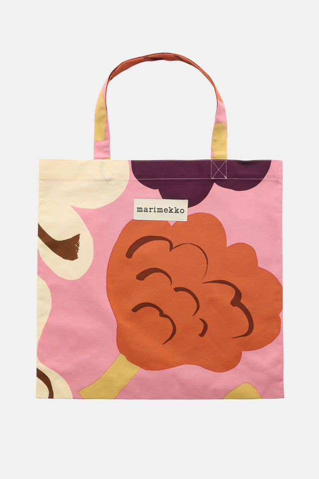 Tote bag with floral design and Marimekko label on a white background