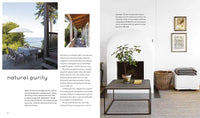A two-page interior design spread showing a home decor lifestyle scene. The left page features a large photo of a balcony overlooking the ocean with outdoor dining chairs and a table, captioned 'natural purity' with several paragraphs of text below.